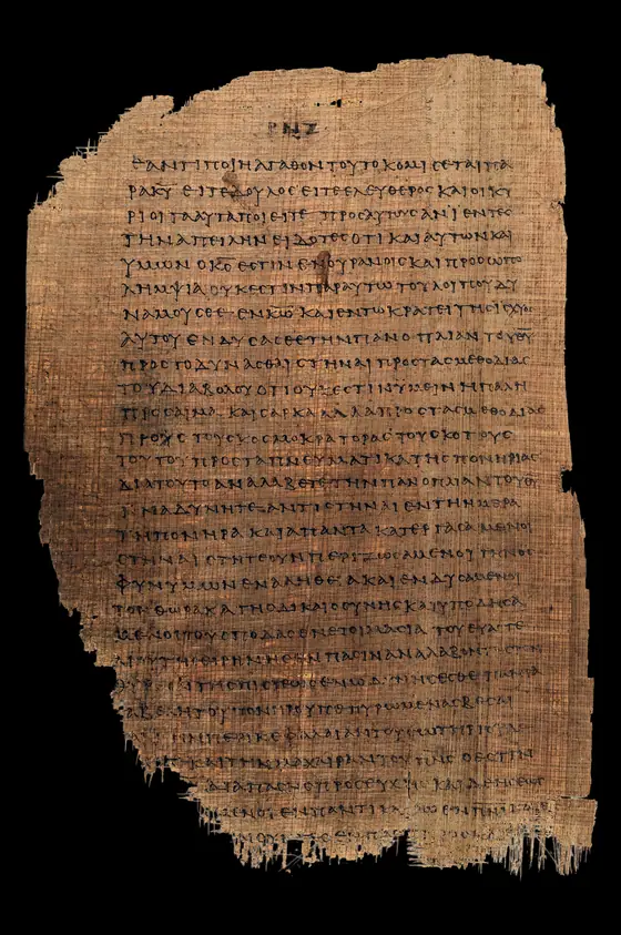 Papyrus 46, folio 157v — Ephesians 6:8–18, copied around AD 200; a column of Greek uncial letters on darkened papyrus.